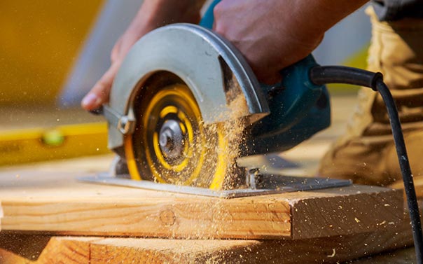 A person using a circular saw